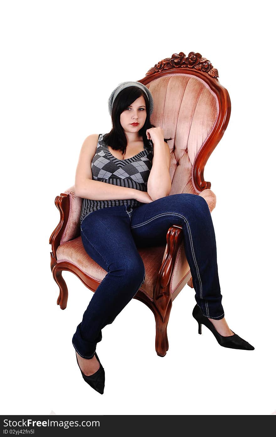 Girl sitting in armchair.