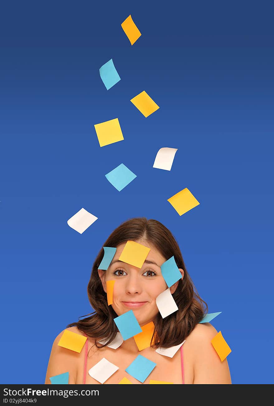 Beautiful woman ans sticky notes isolated over blue