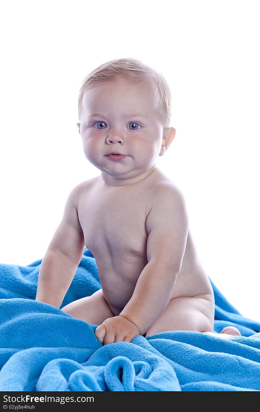 A beautiful baby with blue towel