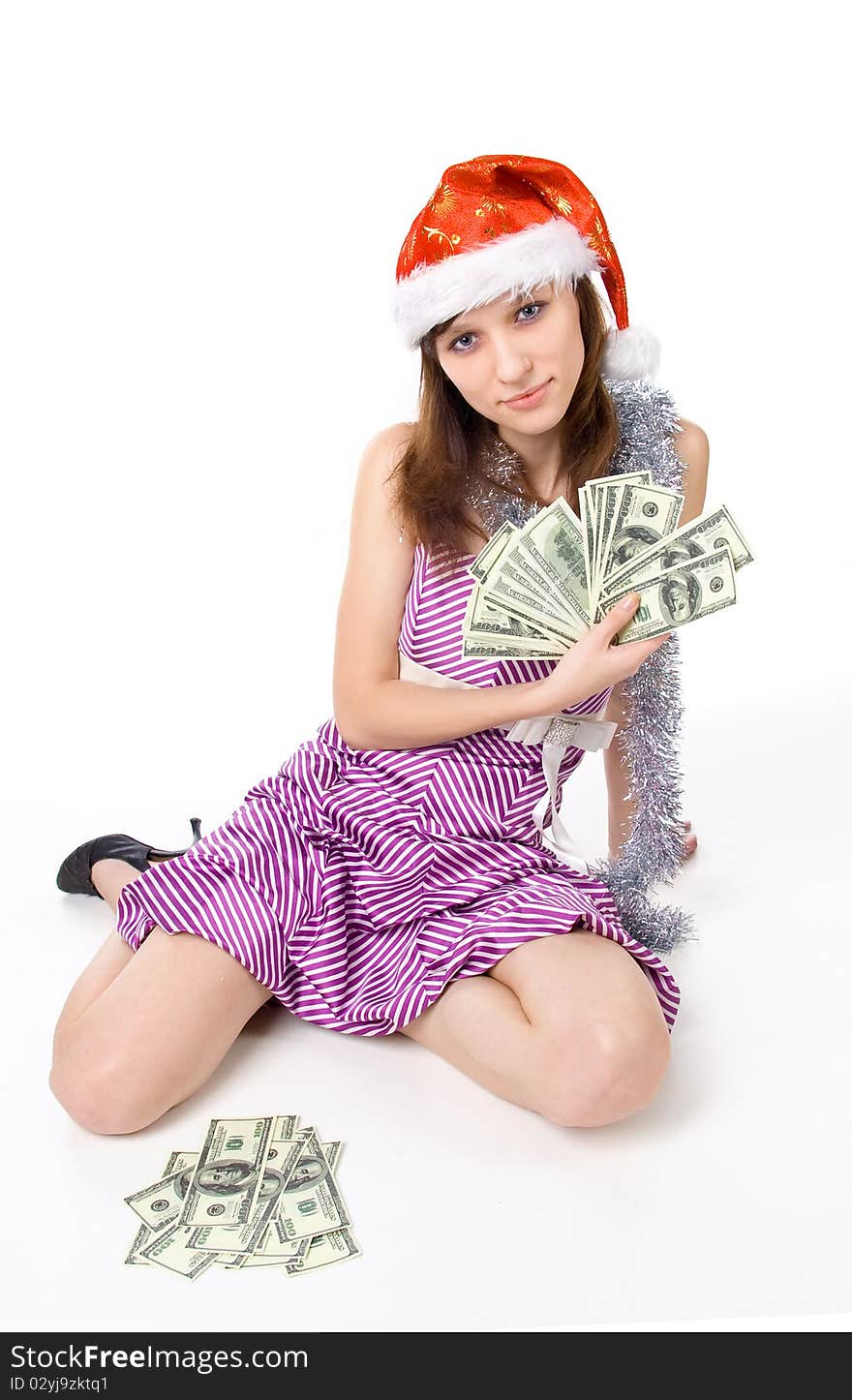 Smiling girl with dollars