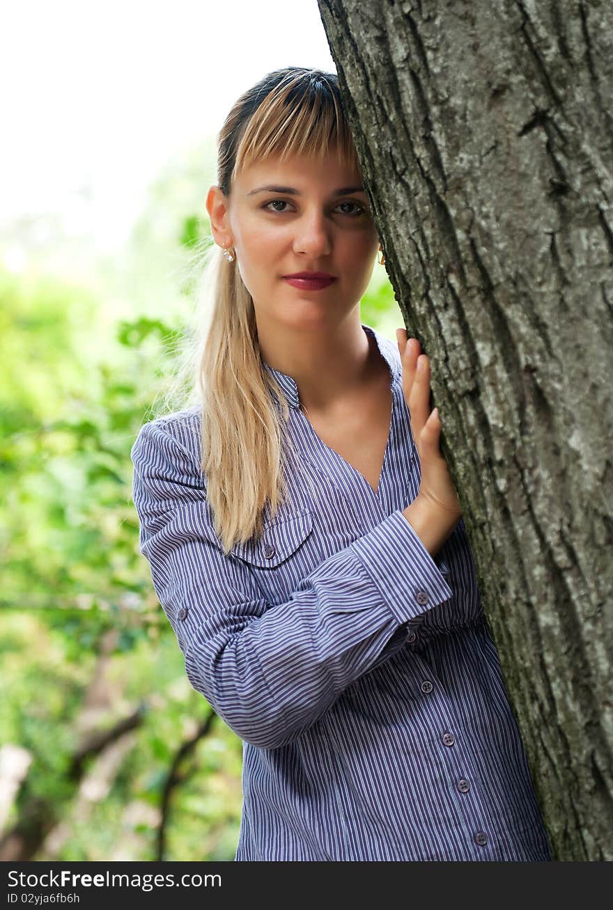 Beautiful young woman relaxing in park