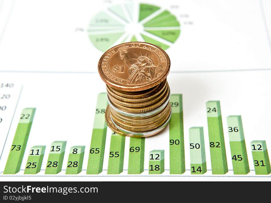 Business graph with stack of coins. Studio shot. Business graph with stack of coins. Studio shot