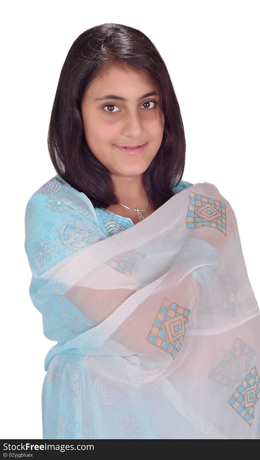 A sweet indian girl wraping her dupatta around her body and looking at the camera sweetly. A sweet indian girl wraping her dupatta around her body and looking at the camera sweetly.