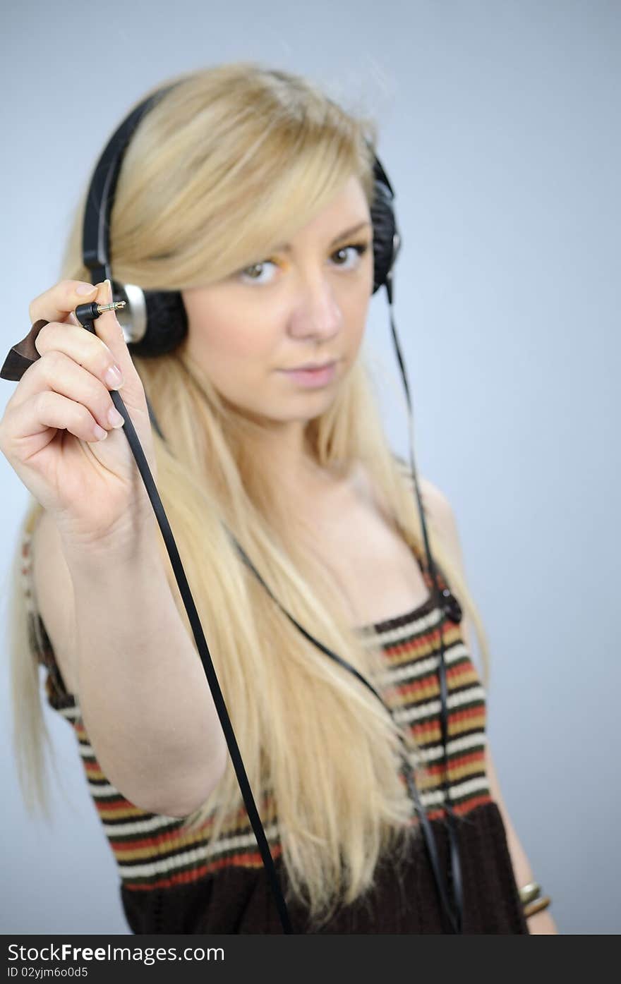 Young woman studying with audio equipments help. Young woman studying with audio equipments help