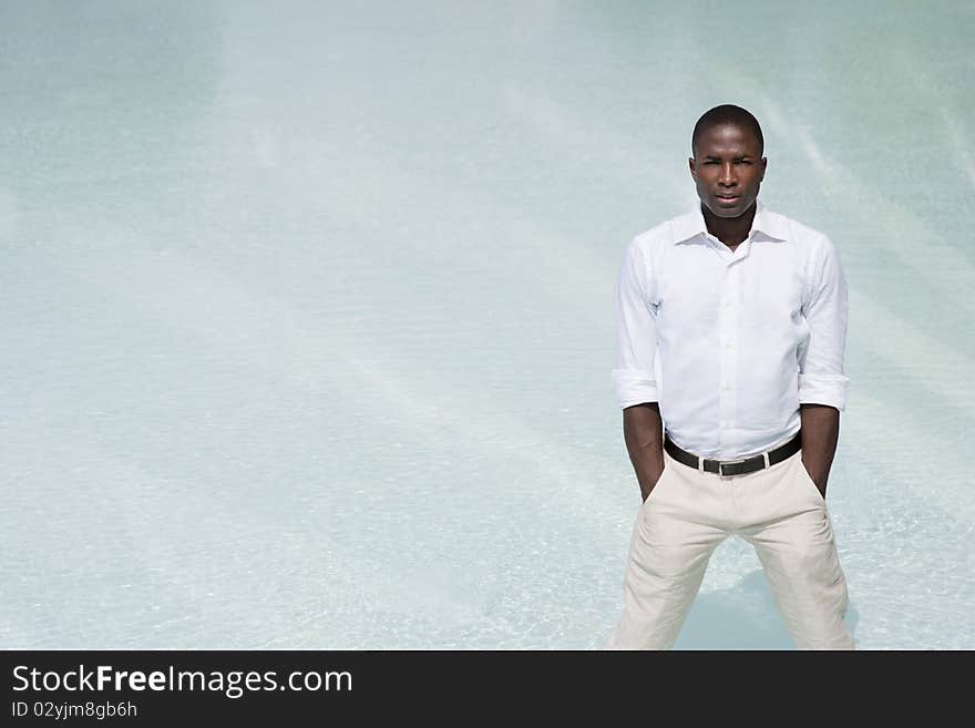 Businessman looking camera, white background