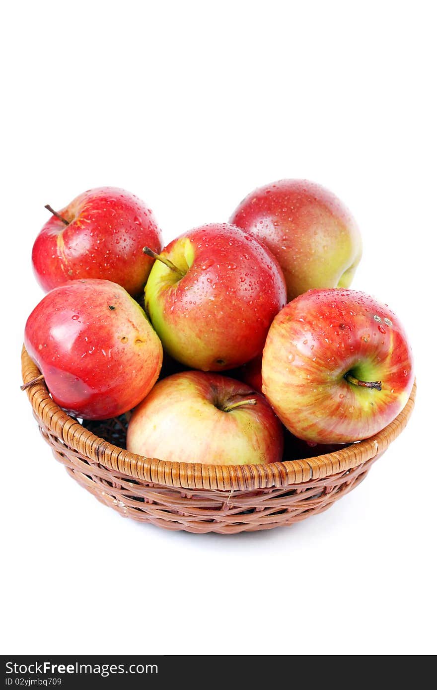 Red apples in a basket on a white background