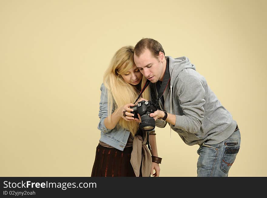 Student at photography explaining positions for model. Student at photography explaining positions for model