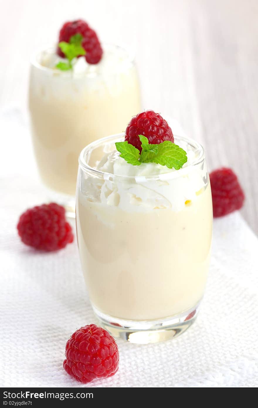 Fresh vanilla cream with raspberries