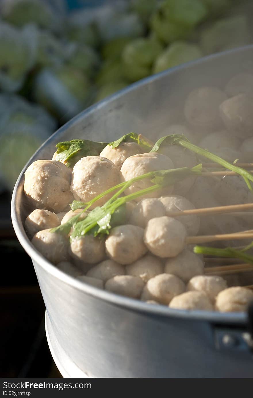 Steam pork balls on sale in a Thai market