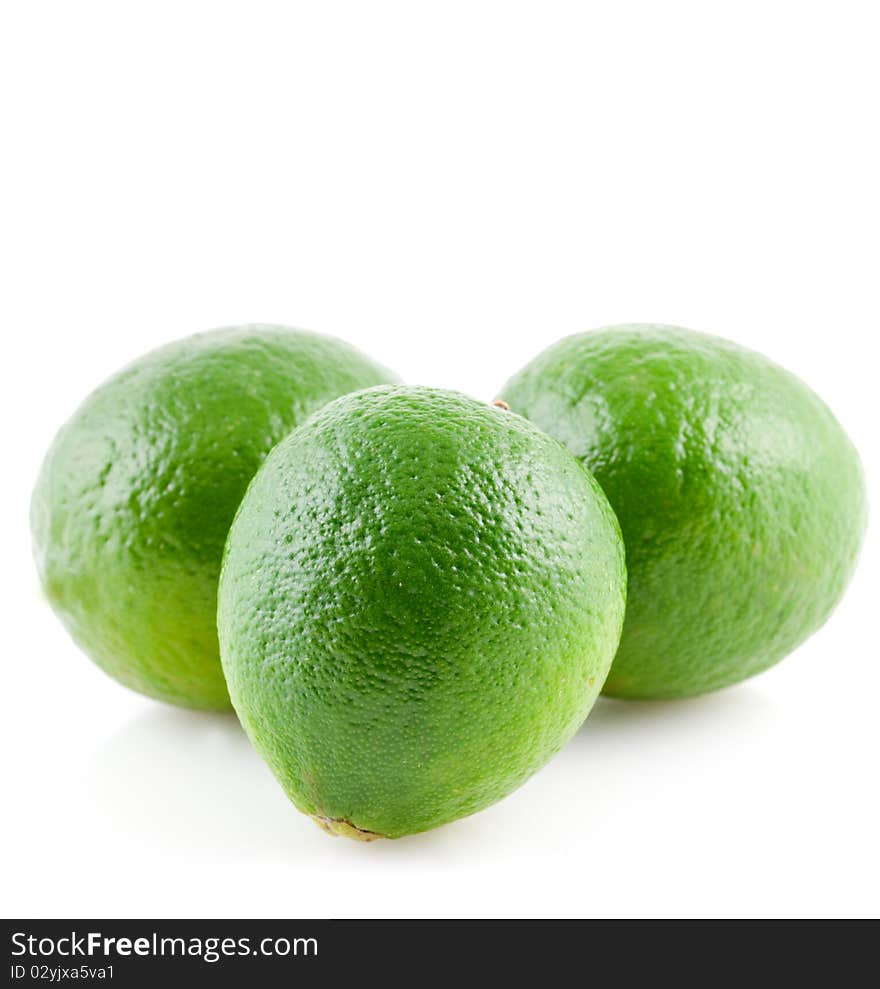 Three limes isolated on white background