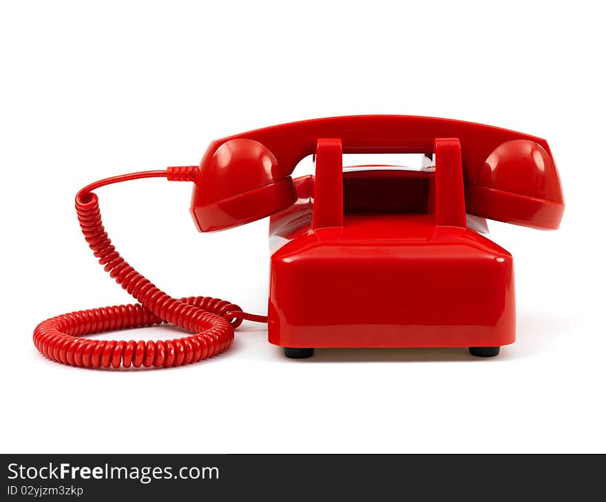 A rotary telephone isolated against a white background. A rotary telephone isolated against a white background