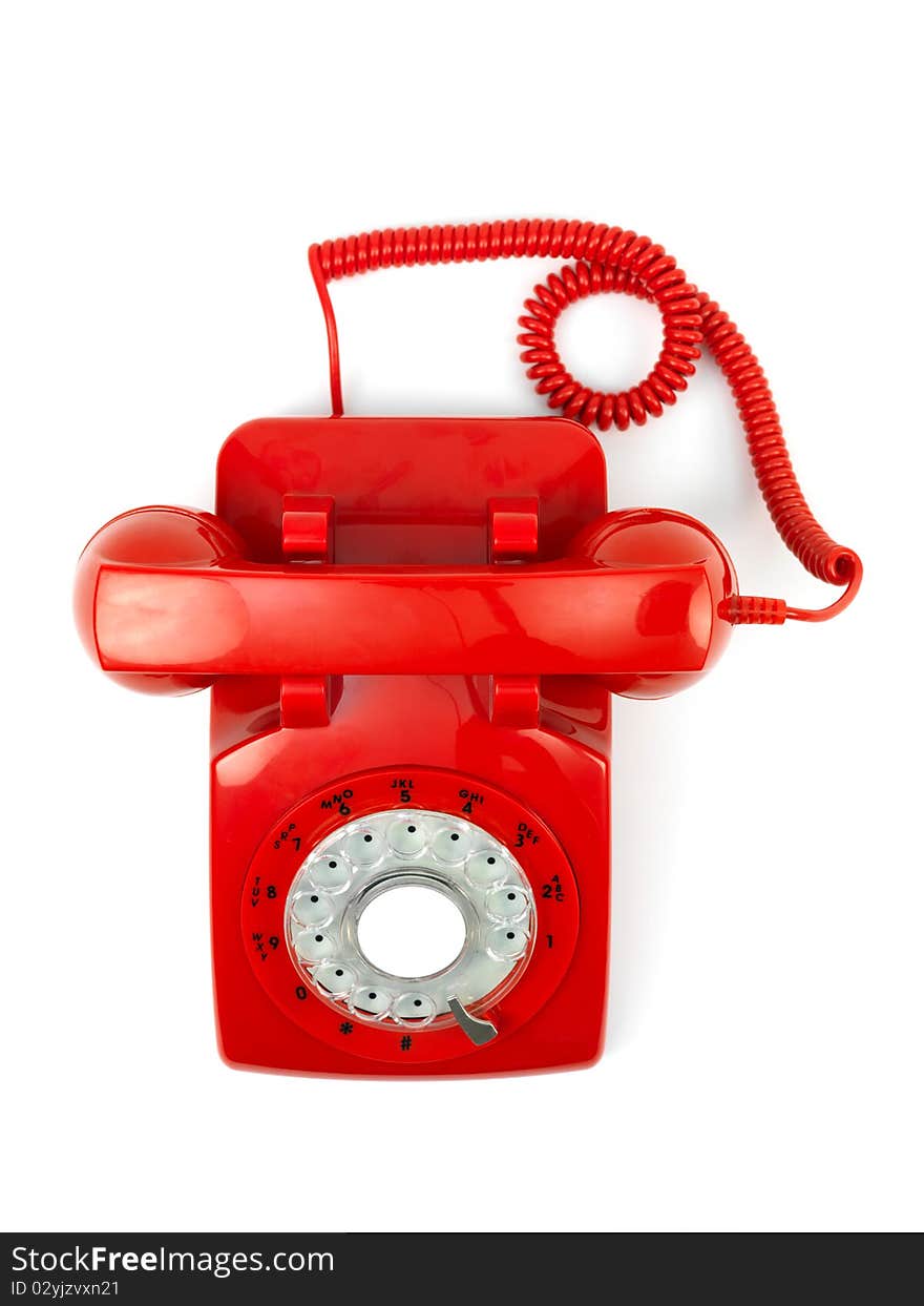 A rotary telephone hand set isolated against a white background. A rotary telephone hand set isolated against a white background