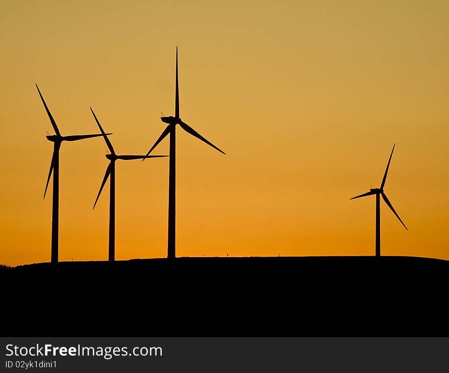 Wind turbines at sunset (sihlouette). Wind turbines at sunset (sihlouette)