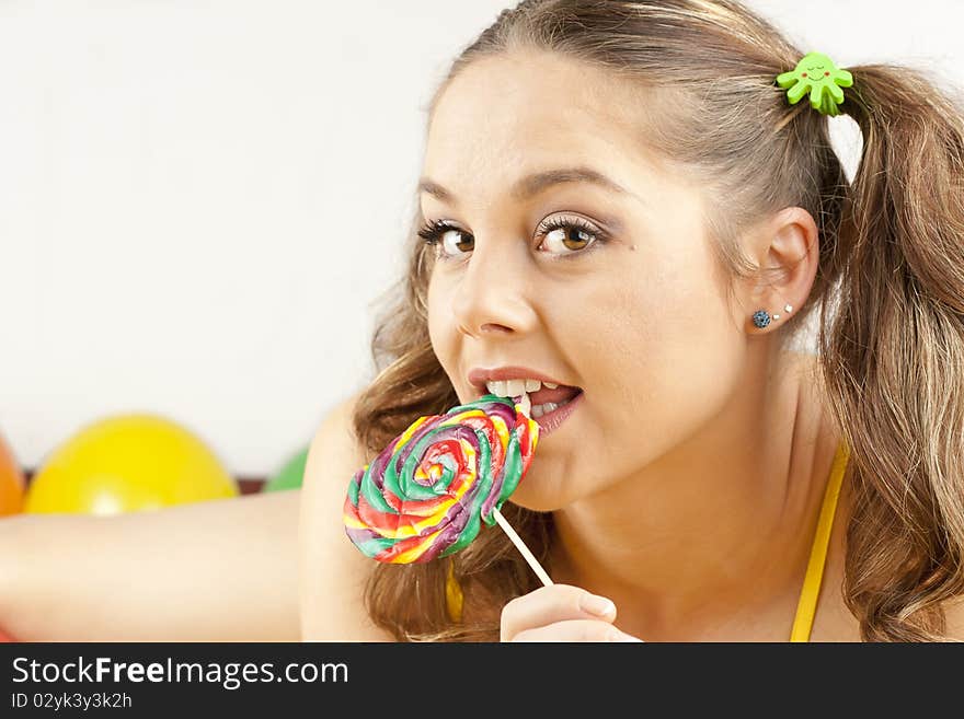 Young woman having fun playing with baloons