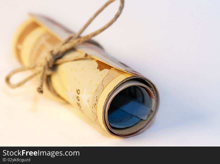 A roll of different Euro bills, tied with a cord. A roll of different Euro bills, tied with a cord.