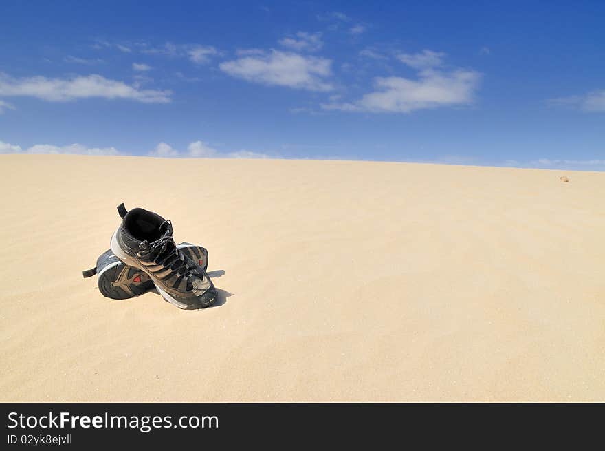 Boots on the sand.  Balck boots in the Desert