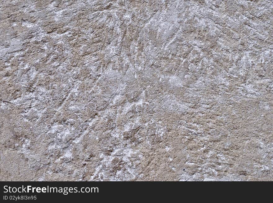 Fragment of scratched gray cement wall background. Fragment of scratched gray cement wall background