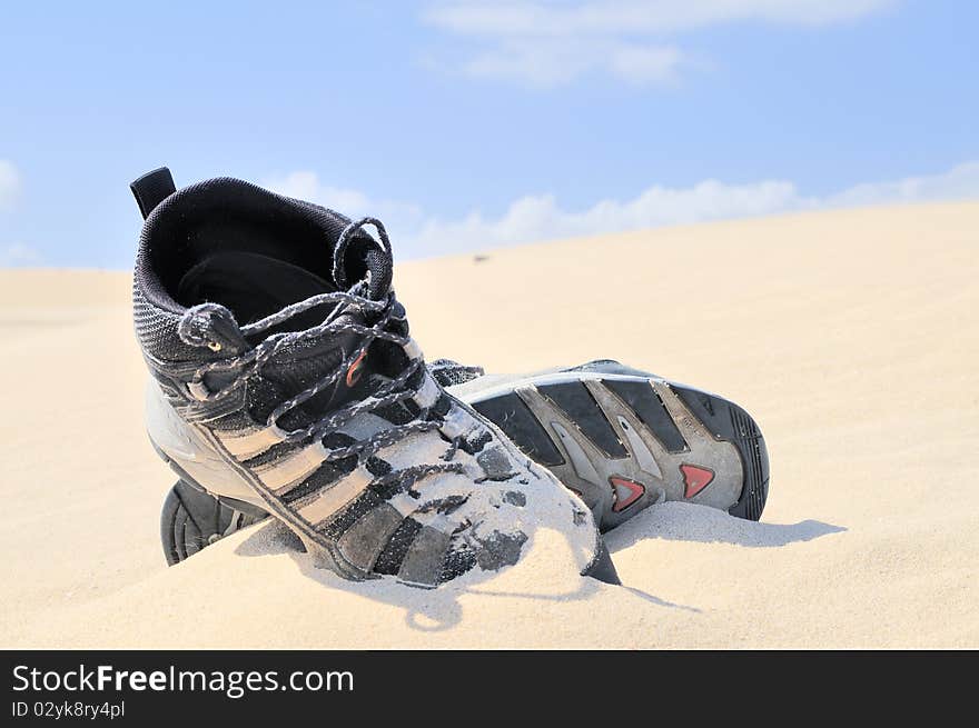 Boots on the sand. Balck boots in the Desert