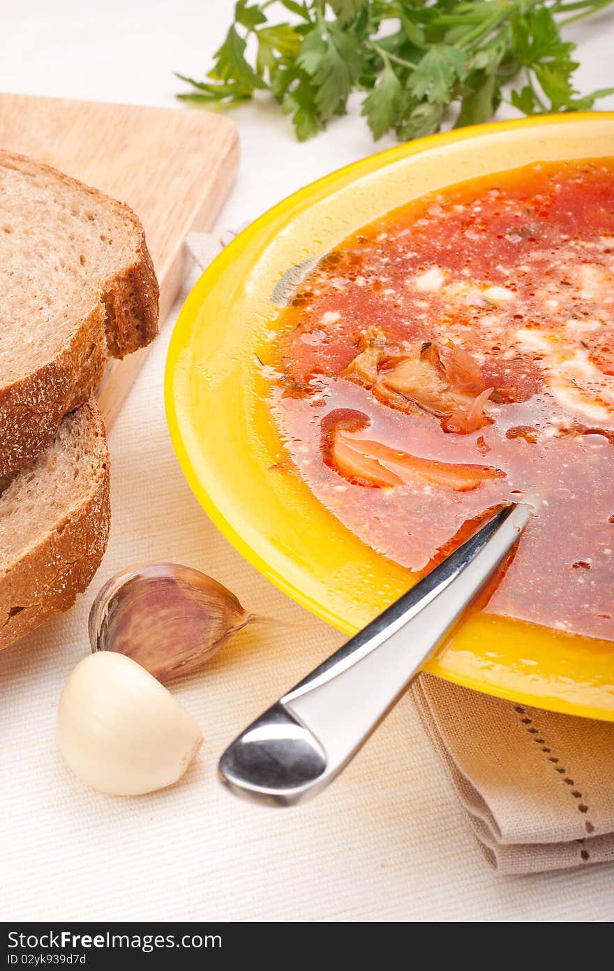 Red-beet soup in yellow plate