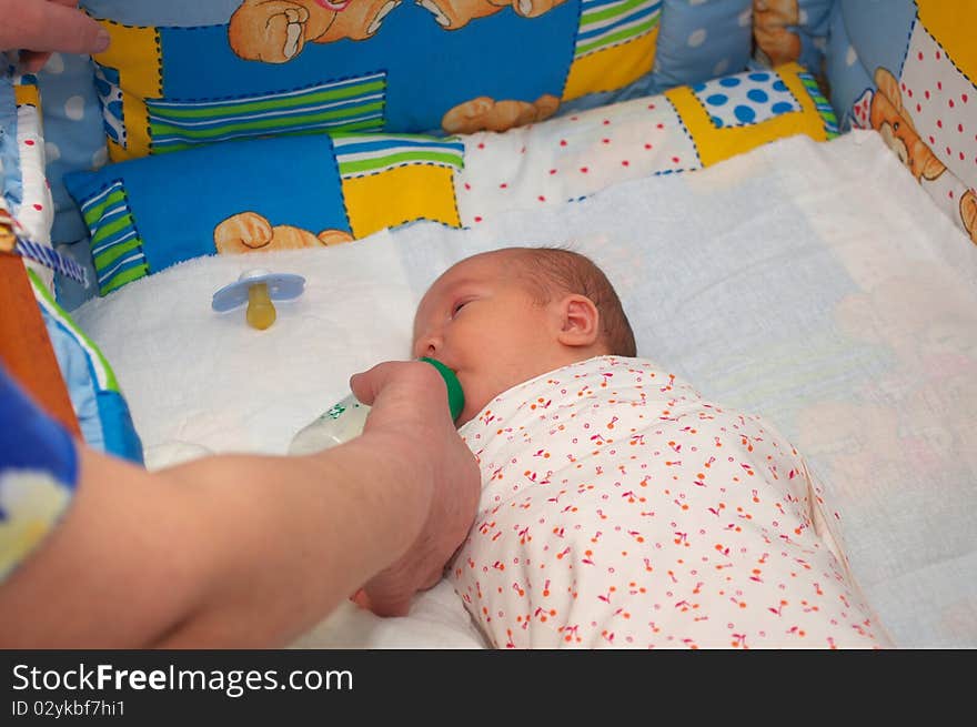 photo of the beautiful baby lying on bed. photo of the beautiful baby lying on bed