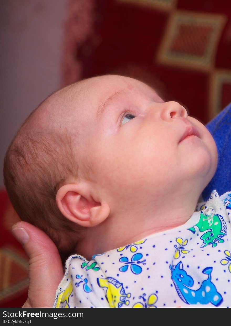 Photo of the beautiful baby on mother hands. Photo of the beautiful baby on mother hands