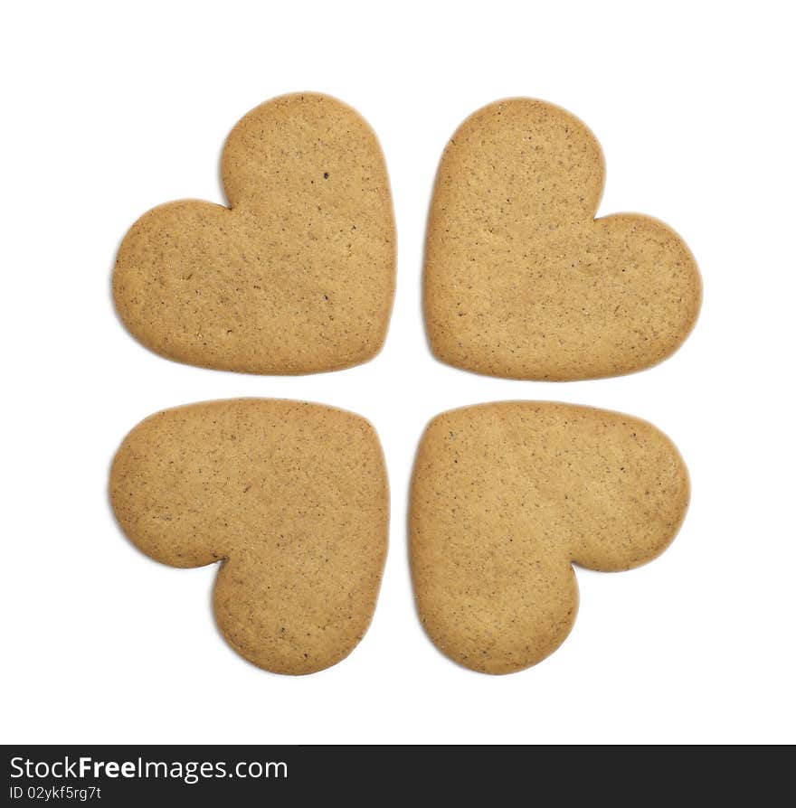 Four heart shaped cookies on white background. Christmas feeling. Four heart shaped cookies on white background. Christmas feeling.