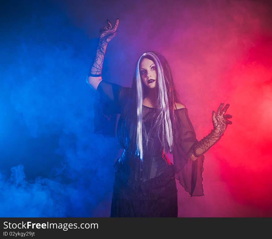 Gothic girl on red-blue smoke background