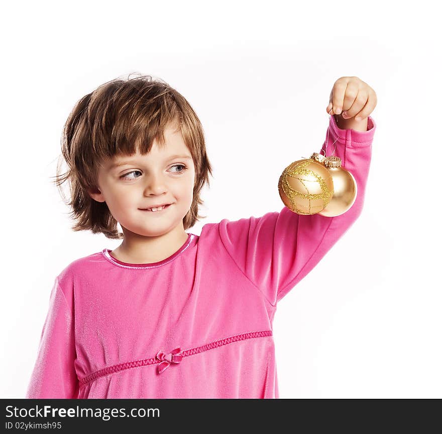 Little girl (three years old) playing with Christmas balls isolated on white. Little girl (three years old) playing with Christmas balls isolated on white