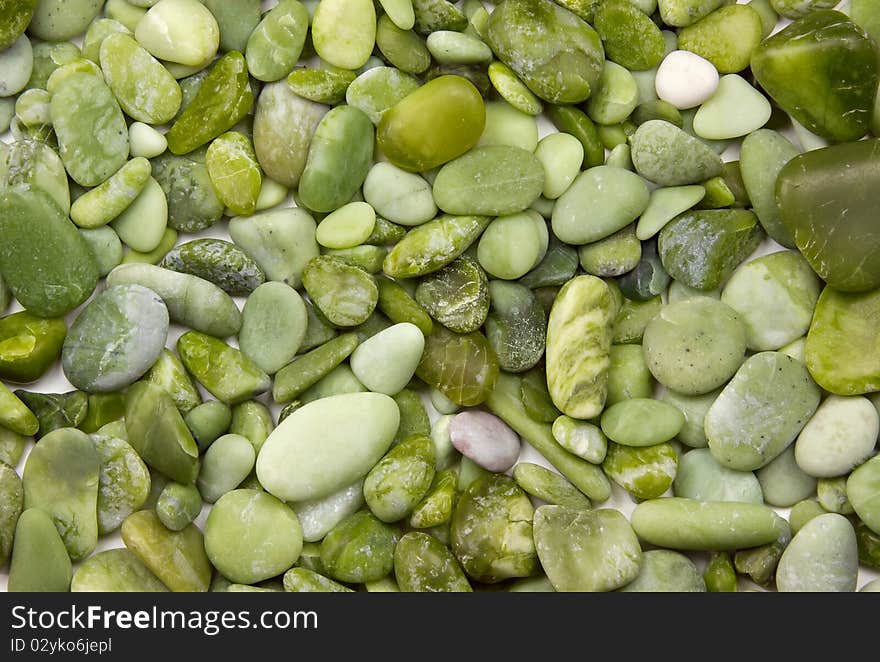 Small green nephrite stones background