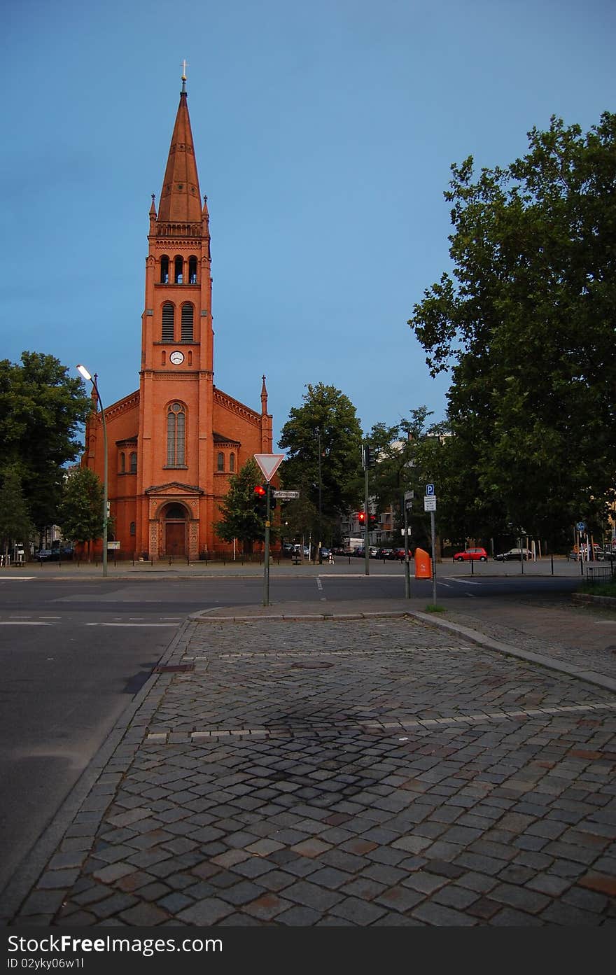 Church of red brick against the blue sky