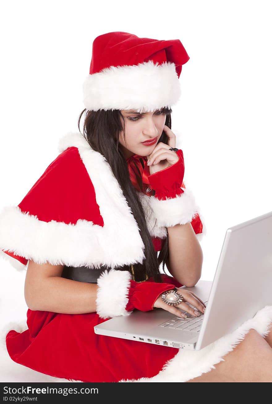 Mrs Santa with a laptop is deep in thought. Mrs Santa with a laptop is deep in thought.