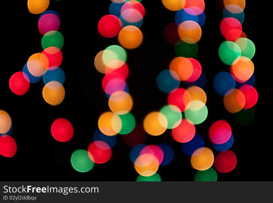 Abstract bokeh lights on a dark background. Abstract bokeh lights on a dark background.