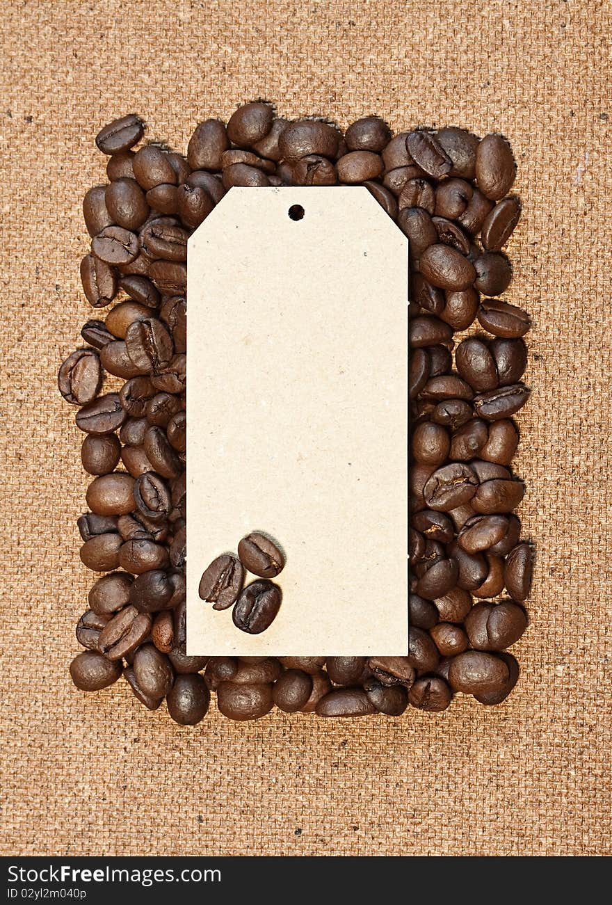 Coffee beans with card on a natural background. Coffee beans with card on a natural background.