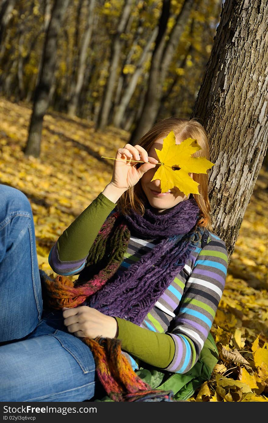 Woman and a yellow leaf