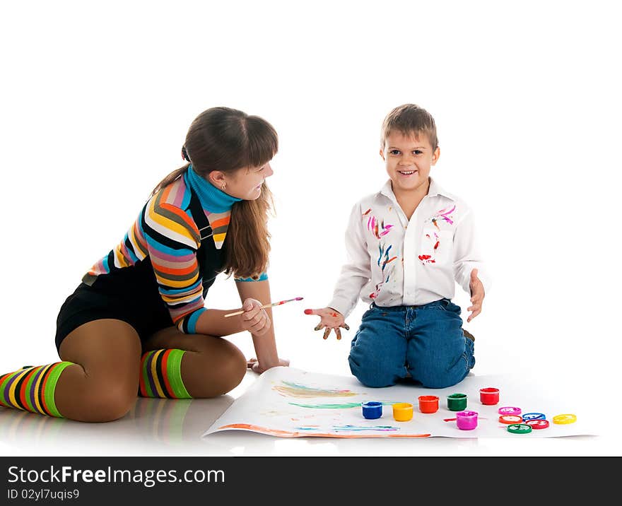 Adorable boy and his mom covered in bright paint.