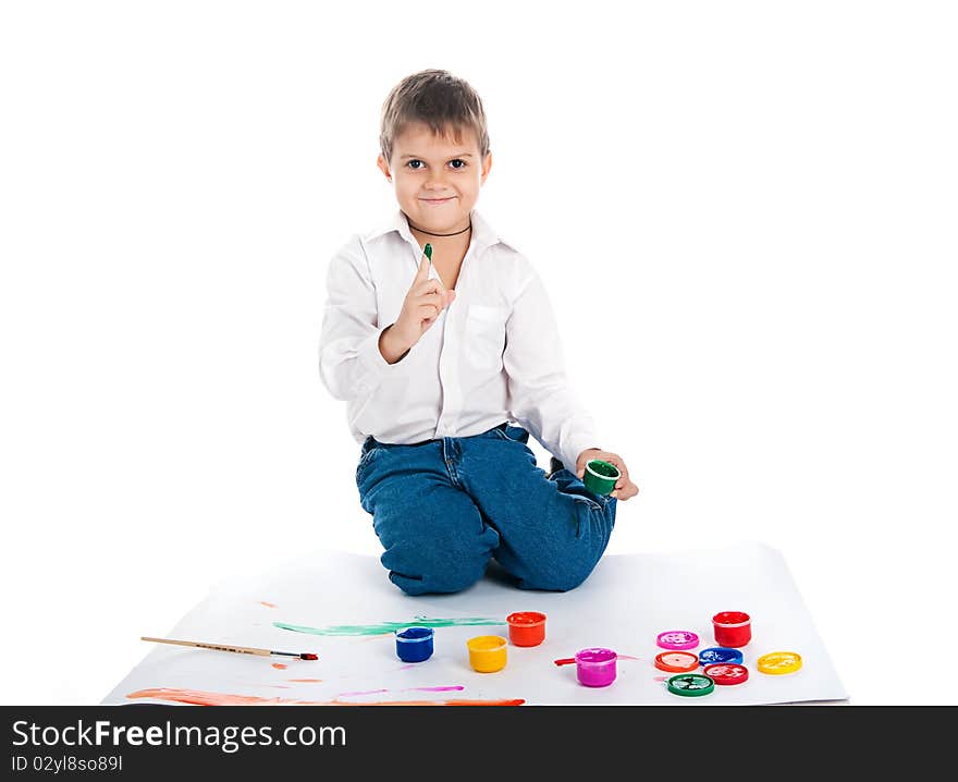 Adorable 4 year old boy covered in bright paint. Adorable 4 year old boy covered in bright paint