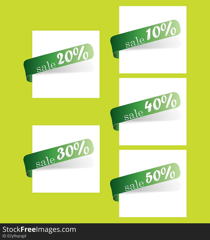 Five green tapes of store discounts in percentage on a white sheet of paper