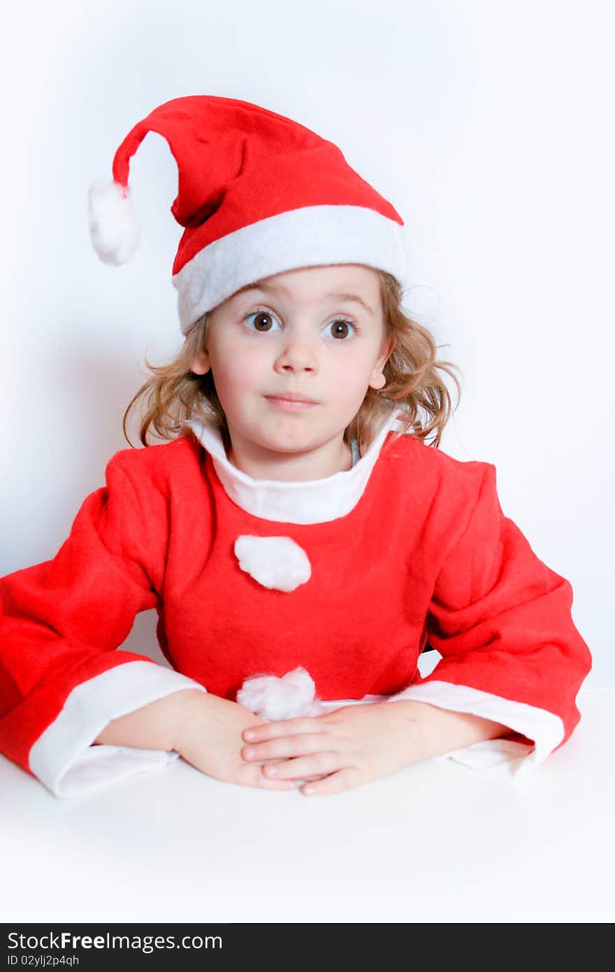 Portrait of little girl in Santa's hat