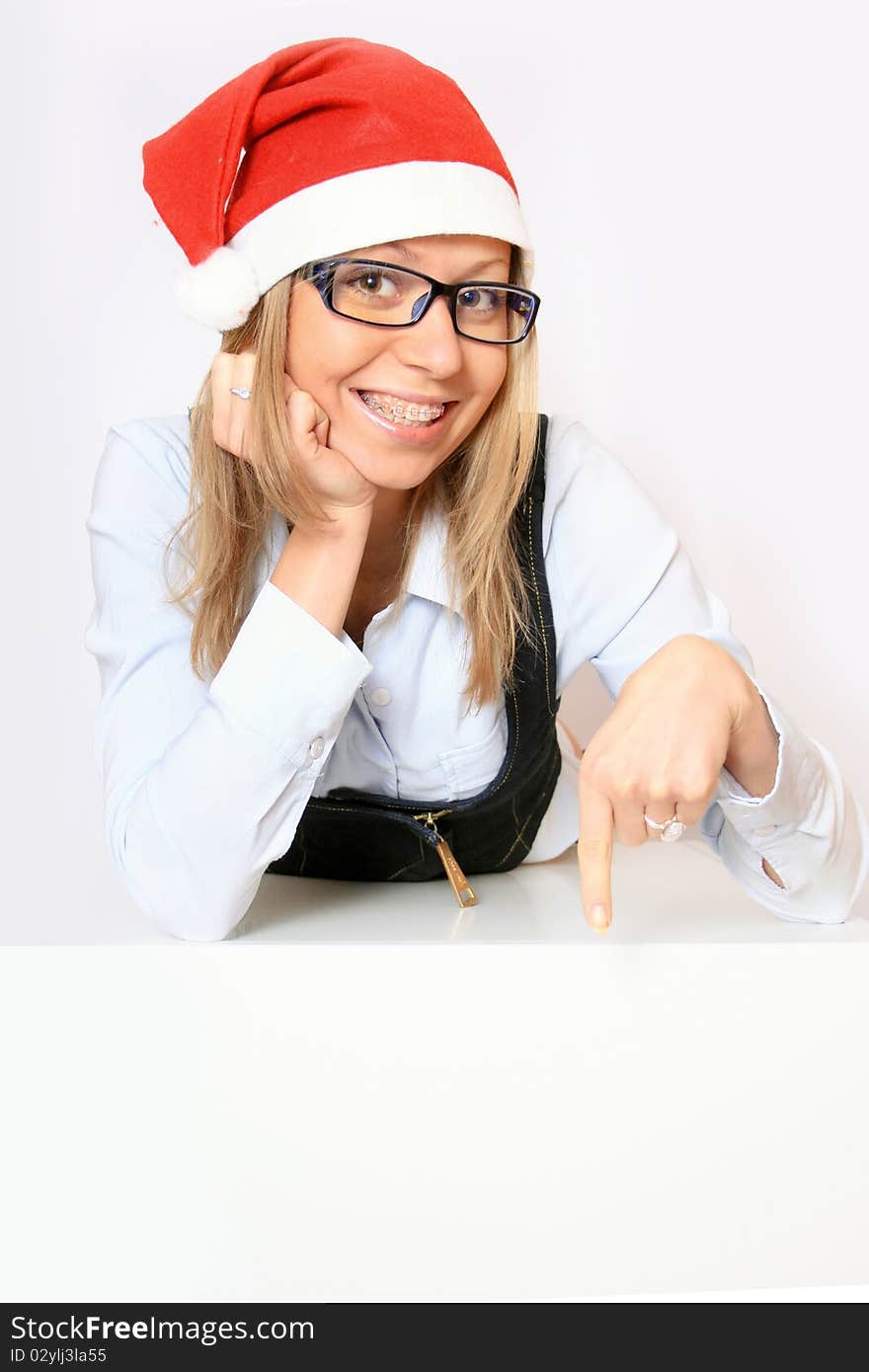 Female santa holding a christmas white card - isolated over a white background