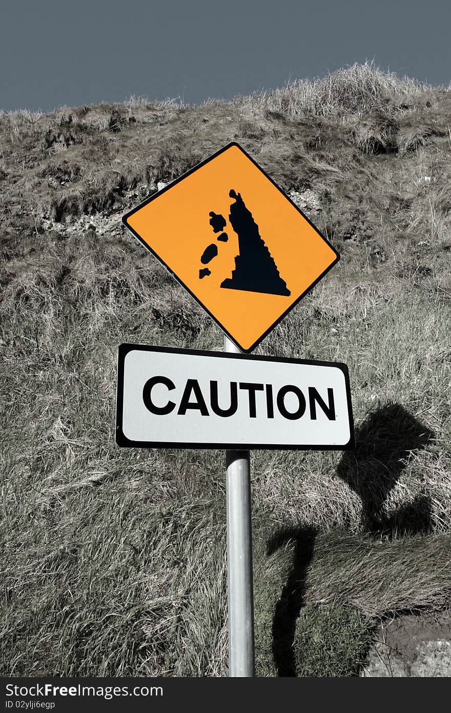 Landslide caution and warning road sign