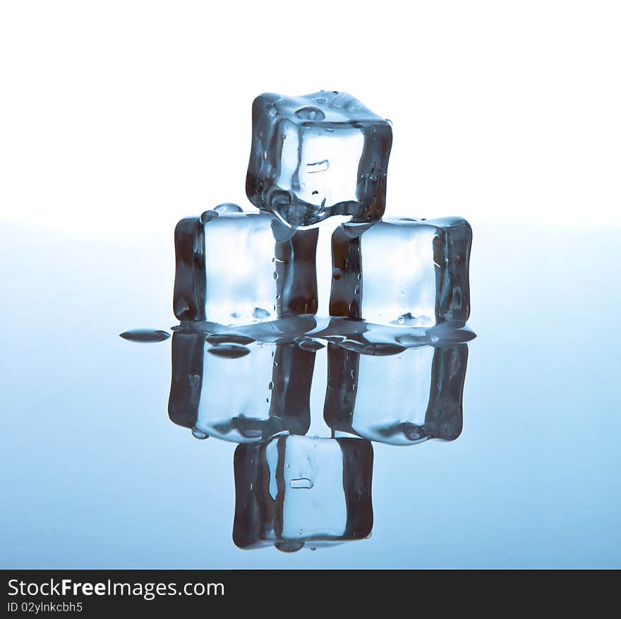 Melting ice cubes on glass table. Melting ice cubes on glass table.