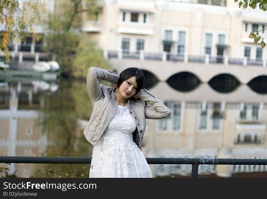 Girl walking near river in park