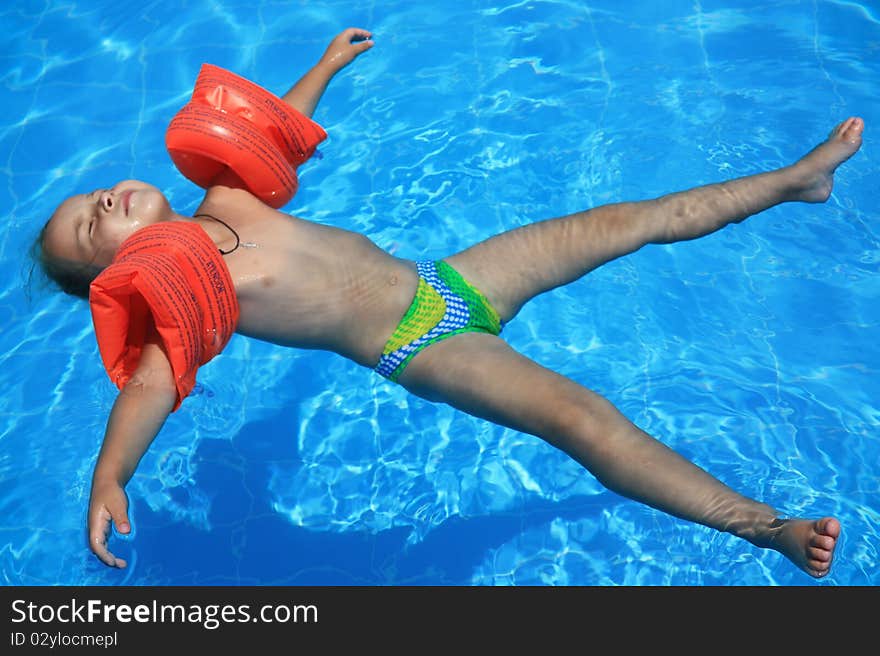 Girl lying on water like a star