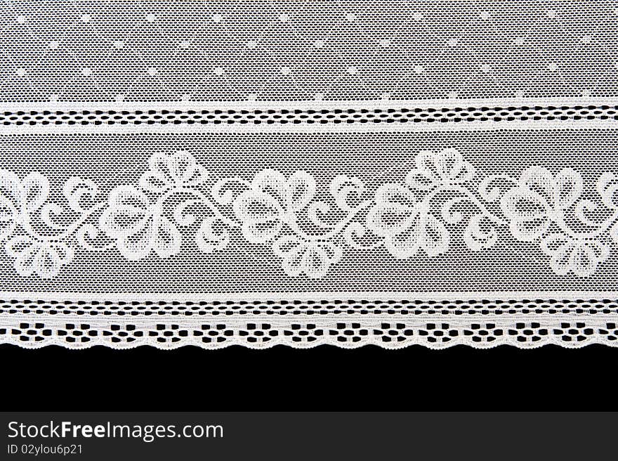 Decorative white lace on insulated black background