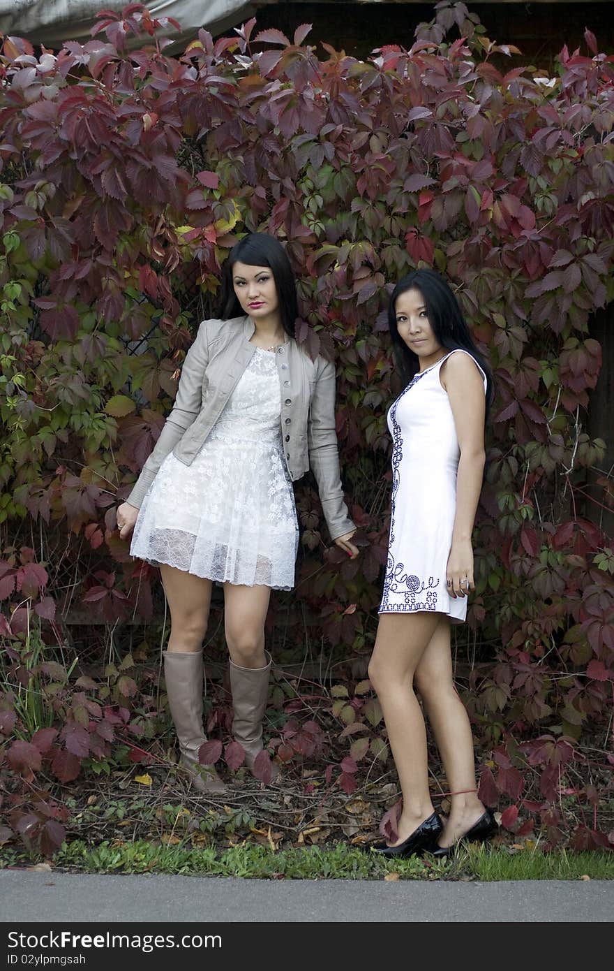 Two female friends walking outdoor