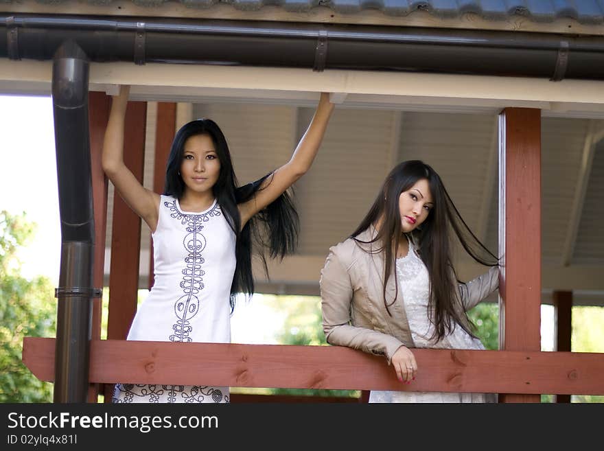 Two girls on veranda