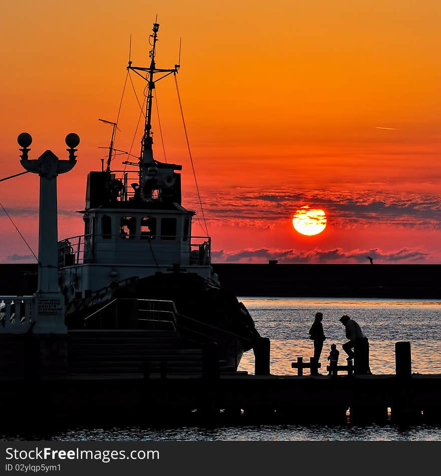 Walking at sunset at the seaport