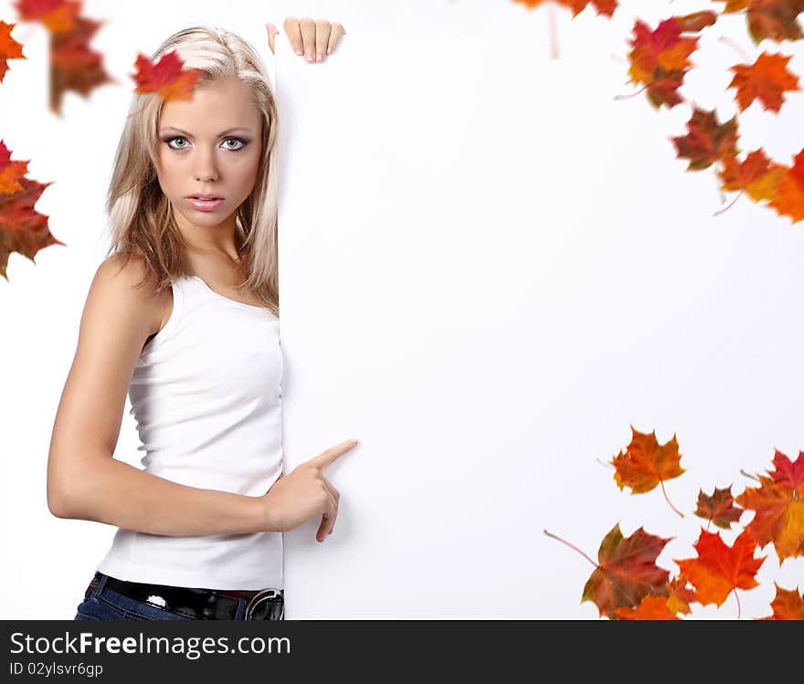 Sexy girl holding a billboard over a white background. Sexy girl holding a billboard over a white background