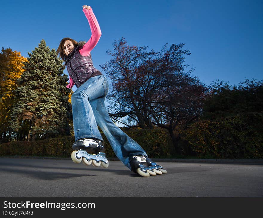 Wide-angle shot of a sliding rollerskater - motion blur on person. Wide-angle shot of a sliding rollerskater - motion blur on person