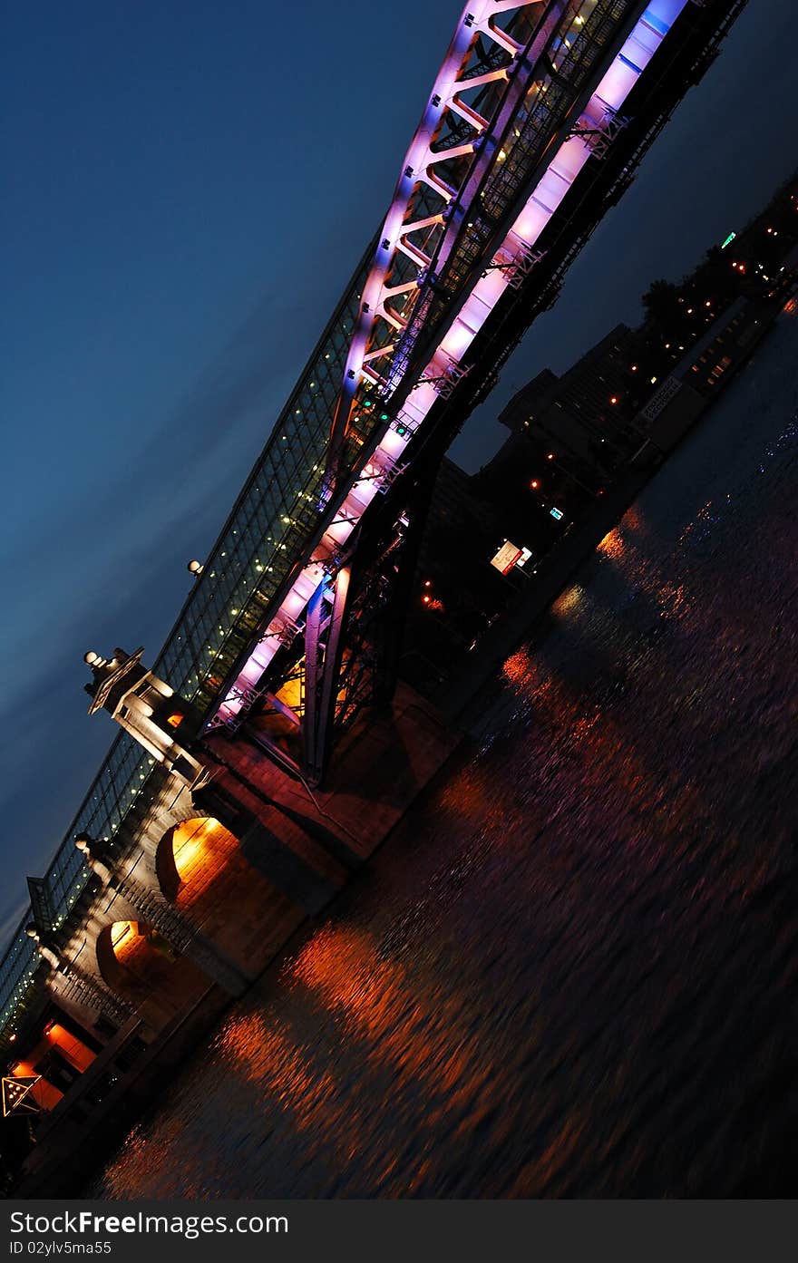 Night bridge and it's light reflections in a river